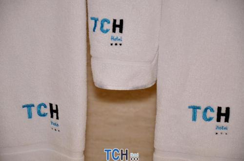 
a white towel hanging on the side of a white wall at TCH Hotel in Lorquí
