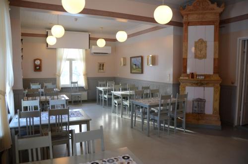 an empty dining room with tables and chairs at Lomakoti Onnela in Haukipudas