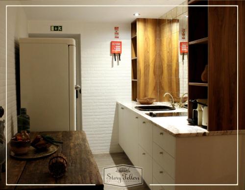 a kitchen with a sink and a counter top at Storytellers Villas in Sintra
