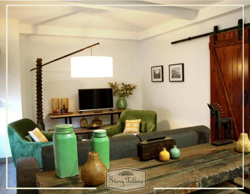 a living room with a couch and a table at Storytellers Villas in Sintra
