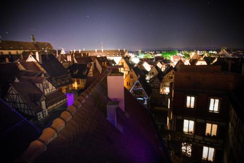 a view of a city at night at Loft Spa Cathedrale in Colmar