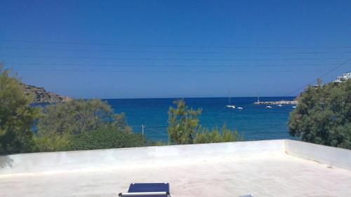 a room with a view of the ocean at VILA INSPIRATION - ON KINI BEACH in Kinion