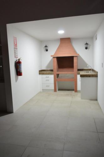 a room with a kitchen with a table in it at Hotel Gran Mariscal Quito in Quito
