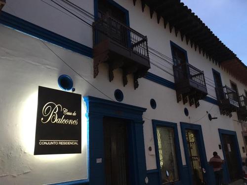 a building with a sign on the side of it at Casa de Balcones in Garzón