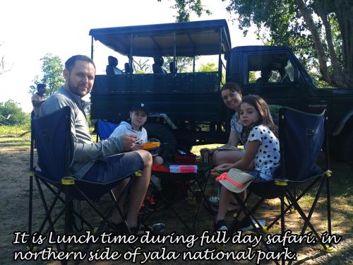 a group of people sitting at a table with a vehicle at Yala Avian Eye Safari in Buttala