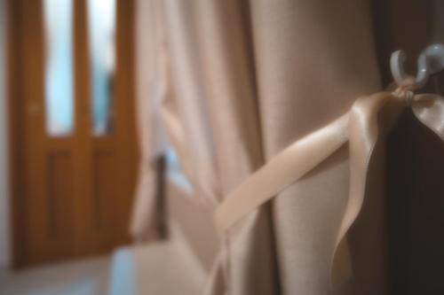 a close up of a curtain on a window at Il Vicolo - Affittacamere in Ruvo di Puglia
