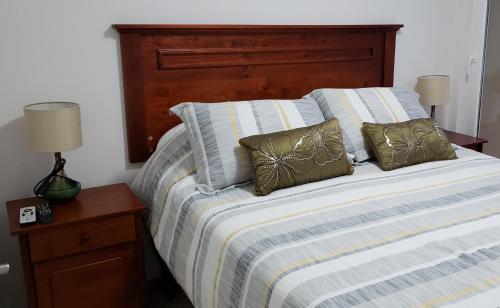 A bed or beds in a room at EDIFICIO ALTA VISTA PUCON