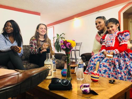a group of three women sitting around a coffee table at Hotel & Suites Cerro Roj0 in Tlatlauquitepec