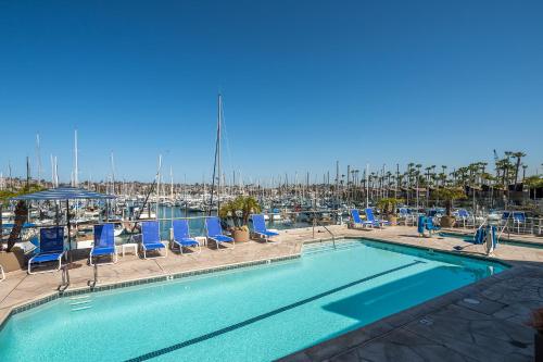 a large swimming pool with chairs and a marina at Bay Club Hotel and Marina in San Diego