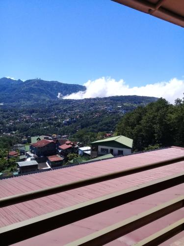 a view of a city from the roof of a building at ASHBURN'S TRANSIENT BAGUIO - 3rd to 5th floor BASIC SLEEP and GO Accommodation, WITH PARKING, NO ELEVATOR in Baguio