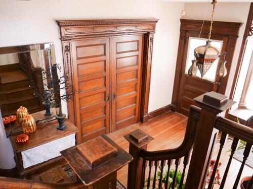 a room with a wooden door and a table at Shadowcrest in Fleischmanns