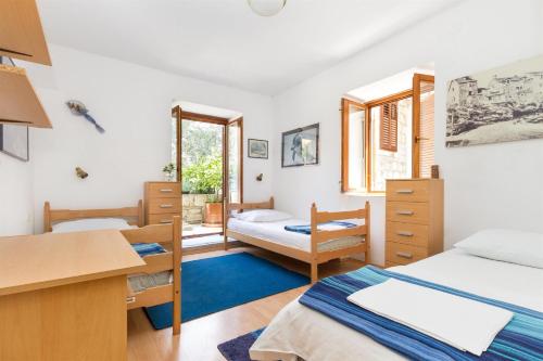 Posteľ alebo postele v izbe v ubytovaní Apartments Varos