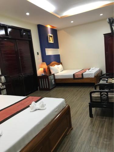 Postel nebo postele na pokoji v ubytování Sunny A Hotel