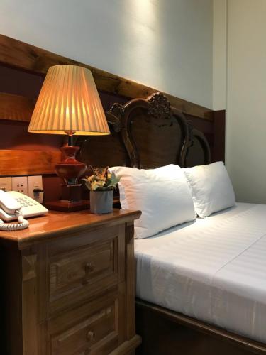 Postel nebo postele na pokoji v ubytování Sunny A Hotel