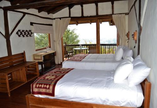 Postel nebo postele na pokoji v ubytování Ilatoa Lodge