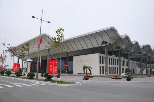 a large building with a curved roof on a street at T&M Luxury Hotel Hanoi in Hanoi