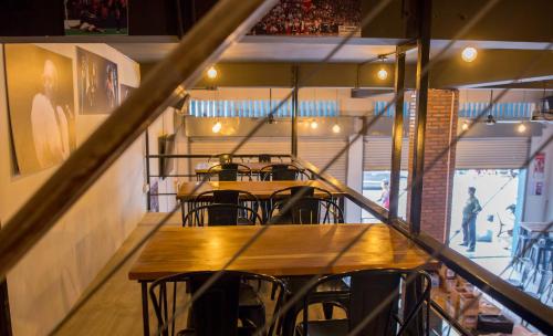 a row of tables and chairs in a restaurant at The Big Easy Phnom Penh in Phnom Penh