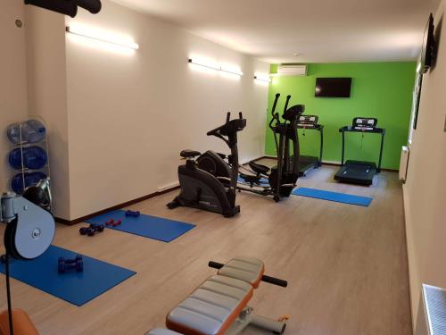 a gym with several exercise equipment in a room at Ibis Styles Charleroi Airport Aero 44 in Charleroi