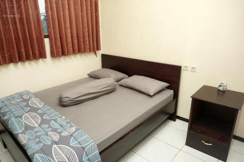 Katil atau katil-katil dalam bilik di Villa Cemara
