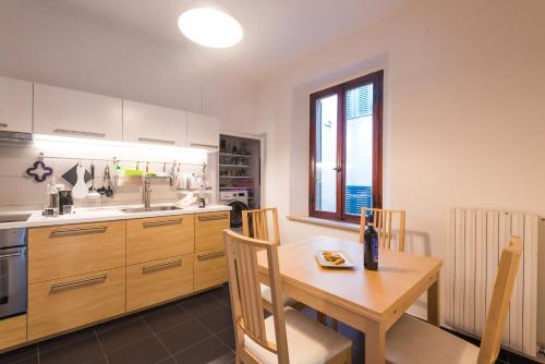 a kitchen with a table and a sink and a table and chairs at Your home in Trequanda in Trequanda