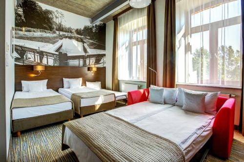 Un pat sau paturi într-o cameră la Hotel Loft 1898