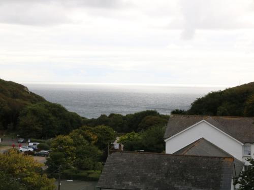 a view of the ocean from a house at The Watch in Porthcurno
