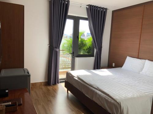 Postel nebo postele na pokoji v ubytování HOÀNG SA HOTEL