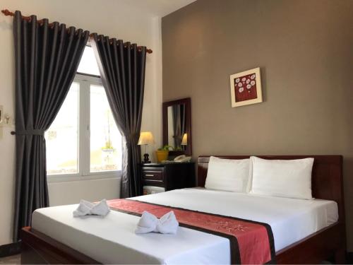 Postel nebo postele na pokoji v ubytování Sunny A Hotel