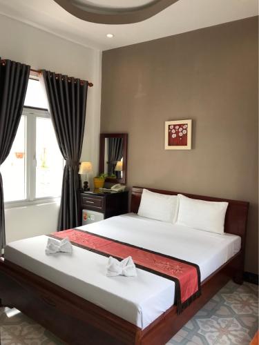 Postel nebo postele na pokoji v ubytování Sunny A Hotel