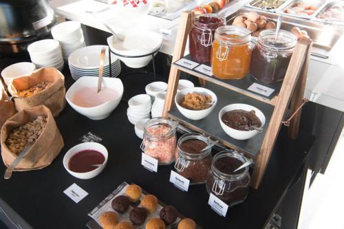 a table topped with lots of different types of food at Postillion Hotel Amsterdam in Amsterdam