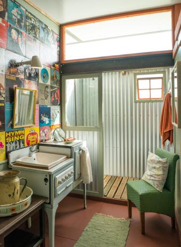 a bathroom with a sink and a mirror at ECO Lodge Villa Villekula in The Crags