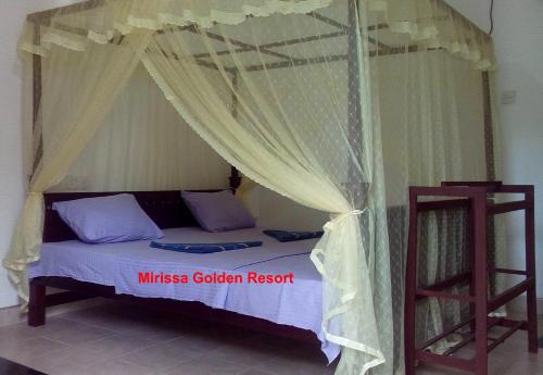 Postel nebo postele na pokoji v ubytování Mirissa Golden Resort