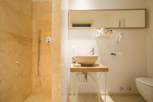 a bathroom with a bowl sink and a shower at B&B Santa Maria del Fiore in Florence