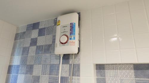 a scale on the wall of a bathroom at Today Tonight in Bangkok