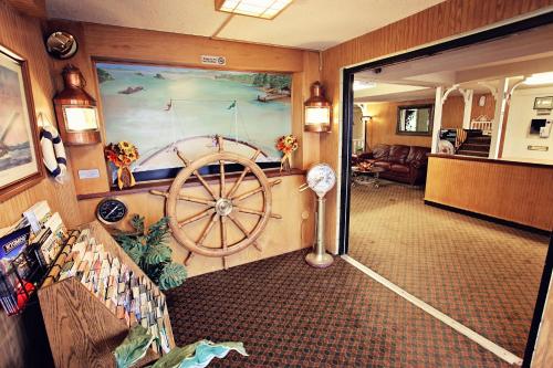 a living room with a large painting of a boat at National 9 Inn Showboat in Casper