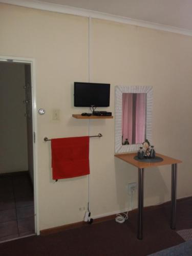 TV a/nebo společenská místnost v ubytování Pride Rock Accommodation