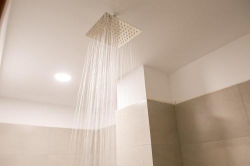 a shower curtain hanging from the ceiling of a room at The Big Easy Phnom Penh in Phnom Penh