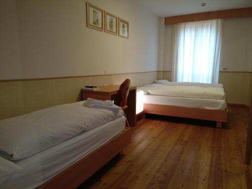 Una cama o camas en una habitación de Lumen