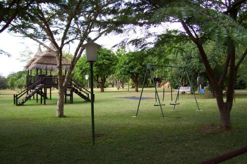 a park with a swing set and a playground at Jock of the Bushveld in Barberton