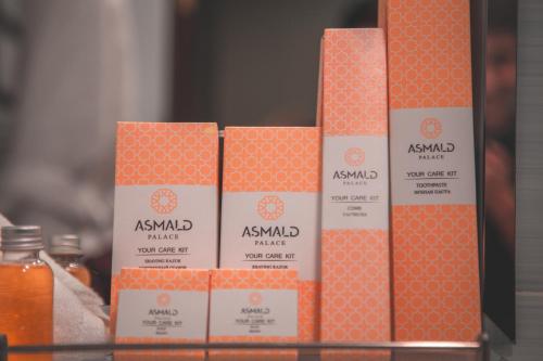 a group of orange boxes sitting on a shelf at Asmald Palace Hotel in Kokand