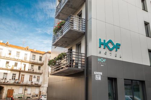 a building with a hos sign on the side of it at HOF HOTEL in Kaunas