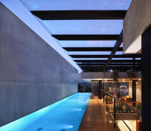 a swimming pool in the middle of a building at Lakewood Residence in Kandy