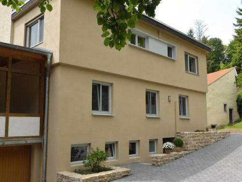 a large house with a building at Irreler Mühle Ferienwohnungen und Ferienhäuser in Irrel