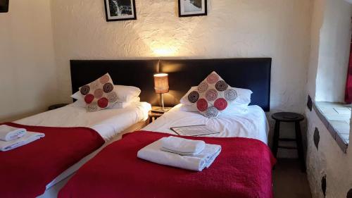 A bed or beds in a room at Crown Inn 