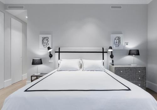 Postel nebo postele na pokoji v ubytování Justicia Apartment II by Flatsweethome