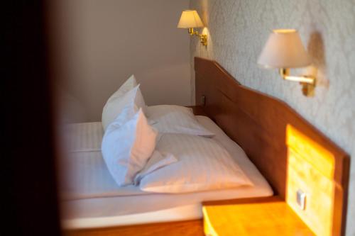 Кровать или кровати в номере Hotel Adria