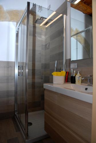 a bathroom with a shower and a sink at Antica Dimora I Dragoni in Cagliari
