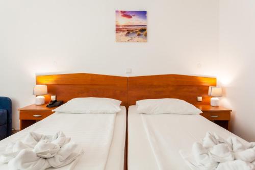 Кровать или кровати в номере Hotel Adria