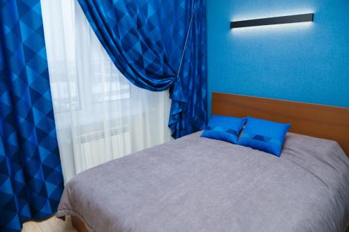 Кровать или кровати в номере Гостиница "Аристократ"