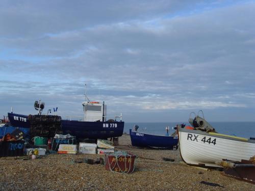 a group of boats sitting on the beach at Breakers Bed and Breakfast in Eastbourne